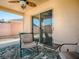 Screened lanai featuring comfortable seating and a tropical-themed rug at 1202 Fernando Ln, The Villages, FL 32159