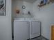Laundry area with modern washer and dryer, providing convenience and efficiency at 1202 Fernando Ln, The Villages, FL 32159