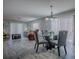 Open-concept living and dining area featuring wood flooring and abundant natural light at 1202 Fernando Ln, The Villages, FL 32159