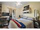 A bedroom featuring decor accents, soft lighting, and neutral paint at 1204 Monterey Dr, Eustis, FL 32726