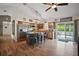 Spacious kitchen with island seating, stainless steel appliances, and sliding doors to the pool area at 1204 Monterey Dr, Eustis, FL 32726