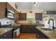 Well-equipped kitchen with stainless steel appliances, granite countertops, and ample cabinet space at 1204 Monterey Dr, Eustis, FL 32726