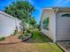 View of backyard featuring a well-manicured lawn and vinyl siding at 1206 Thompson Ave, The Villages, FL 32162
