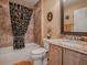 Cozy bathroom featuring a granite vanity, tiled walls, and a shower-tub combination at 1206 Thompson Ave, The Villages, FL 32162