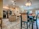 Open-concept design blending kitchen and dining areas, complemented by stylish furnishings and modern appliances at 1206 Thompson Ave, The Villages, FL 32162