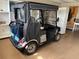 This included Yamaha golf cart has a weatherproof enclosure and custom seating, as well as storage in the back at 1206 Thompson Ave, The Villages, FL 32162