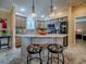 Modern kitchen featuring granite countertops, stainless steel appliances, and bar seating at 1206 Thompson Ave, The Villages, FL 32162