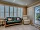 Inviting living room with large windows, comfortable seating, and a view to the outdoor patio at 1206 Thompson Ave, The Villages, FL 32162