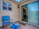 Screened in patio area featuring outdoor seating and views of the yard at 1206 Thompson Ave, The Villages, FL 32162