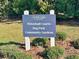Sign indicating community amenities include pickleball courts, dog park, and community gardens at 12077 Lakeshore Way, Oxford, FL 34484