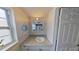 Well-lit bathroom with granite countertops, a modern sink, and a medicine cabinet at 1224 Lakeview Dr, Clermont, FL 34711