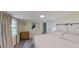 Bright bedroom with a large window, a dresser, and comfortable bedding at 1224 Lakeview Dr, Clermont, FL 34711