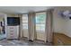 Bedroom featuring two windows with views of the backyard, and contemporary decor at 1224 Lakeview Dr, Clermont, FL 34711