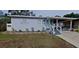 Charming single-story home with a covered carport and a well-maintained front yard at 1224 Lakeview Dr, Clermont, FL 34711
