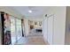 Hallway leading to a bedroom with sliding glass doors to the outside at 1224 Lakeview Dr, Clermont, FL 34711