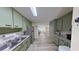 Bright kitchen with stainless appliances, granite countertops, and stylish wood-look flooring at 1224 Lakeview Dr, Clermont, FL 34711