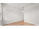 Minimalist bedroom featuring hardwood floors, white walls and trim at 12565 Cynthia Ln, Clermont, FL 34715
