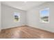 Bright bedroom with hardwood floors and dual windows offering ample natural light at 12565 Cynthia Ln, Clermont, FL 34715