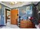 Bright bedroom featuring painted walls, tile flooring, and a ceiling fan at 1406 Hope Ct, Tavares, FL 32778