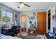 Bright bedroom featuring two closets, blue walls, tile flooring, and a ceiling fan at 1406 Hope Ct, Tavares, FL 32778