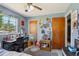 Neutral bedroom, a window offering natural light, and ceiling fan at 1406 Hope Ct, Tavares, FL 32778