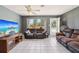 Spacious living room with tile flooring, ample seating, and lots of natural light at 1406 Hope Ct, Tavares, FL 32778