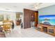Cozy living room featuring tile floors, ceiling fan, and an open layout to dining area at 1406 Hope Ct, Tavares, FL 32778