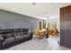 Inviting living area with comfortable seating, tile floors and neutral paint at 1406 Hope Ct, Tavares, FL 32778