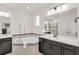 Luxurious bathroom featuring dual vanities, a soaking tub with tile surround, and modern fixtures for a spa-like experience at 14907 Guava Bay Dr, Winter Garden, FL 34787