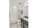 Cozy bathroom features a shower/tub combo, granite-look vanity, and modern fixtures for a functional and inviting space at 14907 Guava Bay Dr, Winter Garden, FL 34787