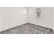 Clean bedroom with neutral carpeting, ample natural light from the window, and a blank canvas for personalization at 14907 Guava Bay Dr, Winter Garden, FL 34787