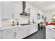Sleek modern kitchen with stainless steel appliances, granite countertops, and ample cabinet space at 14907 Guava Bay Dr, Winter Garden, FL 34787