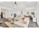 Bright and spacious living room with hardwood floors, modern furnishings, and an open floor plan at 14907 Guava Bay Dr, Winter Garden, FL 34787