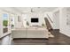 Spacious living room has sleek floors, neutral decor, and staircase access at 14907 Guava Bay Dr, Winter Garden, FL 34787