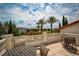 Outdoor patio showcasing palm trees, seating area, and stunning views at 14907 Guava Bay Dr, Winter Garden, FL 34787