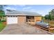 Barn featuring a garage, horse stalls, fresh stained wood, and a propane tank for utilities at 15245 Arabian Way, Montverde, FL 34756