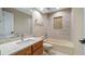 Bathroom features a vanity, tub, and tiled shower at 15245 Arabian Way, Montverde, FL 34756