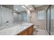 Modern bathroom featuring a marble vanity, glass shower, and a clean, bright design at 15245 Arabian Way, Montverde, FL 34756