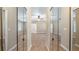 Spacious bedroom with wall-to-wall mirrored closet doors, neutral carpeting, and a ceiling fan at 15245 Arabian Way, Montverde, FL 34756
