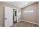 Bedroom with neutral carpet, trim, and walls with a linen closet and view of Primary bathroom at 15245 Arabian Way, Montverde, FL 34756