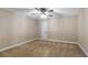 Neutral bedroom with carpet flooring and ceiling fan at 15245 Arabian Way, Montverde, FL 34756