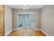 Bright dining room featuring wood floors, a bay window and modern lighting at 15245 Arabian Way, Montverde, FL 34756