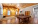 This game room features wood paneling, large windows, and entertainment setup with projector at 15245 Arabian Way, Montverde, FL 34756