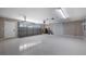 Clean, well-lit garage with epoxy flooring, ample storage, and a functional door at 15245 Arabian Way, Montverde, FL 34756