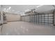 Spacious three-car garage with ample lighting and a clean, epoxy-coated floor at 15245 Arabian Way, Montverde, FL 34756