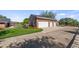 A large three-car garage with manicured landscaping, located next to home and pool at 15245 Arabian Way, Montverde, FL 34756