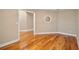 Hallway showing hardwood floors and neutral paint colors at 15245 Arabian Way, Montverde, FL 34756