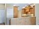 Kitchen with breakfast bar, granite countertops, and ample cabinet space at 15245 Arabian Way, Montverde, FL 34756