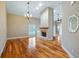 Living room featuring hardwood floors, a fireplace, and natural light at 15245 Arabian Way, Montverde, FL 34756