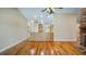 Spacious open-concept living room with wood floors and kitchen view at 15245 Arabian Way, Montverde, FL 34756